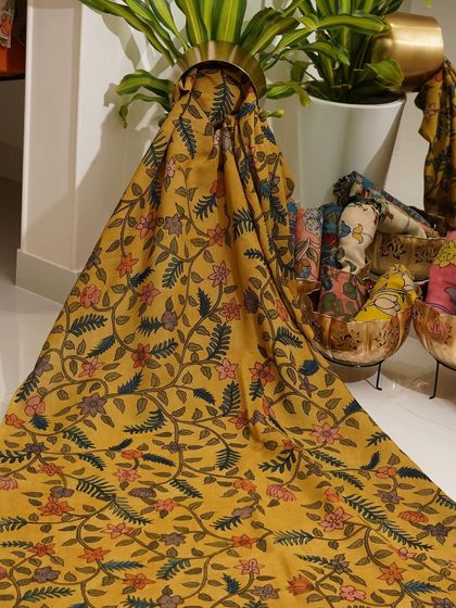 This is a glimpse into my Kalamkari Edition, featuring a wide array of hand-painted dupattas and fabrics from the Indralokam series. Each piece is a unique story, available for you to customize into your dream outfit.