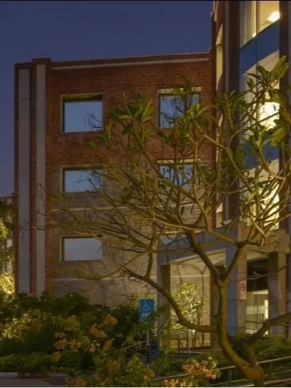 A close-up of the entrance and landscaping at the ISID. I believe in sowing the seeds of a green environment in every project. The integration of trees and green patches provides thermal comfort and a human scale to the institutional design.
