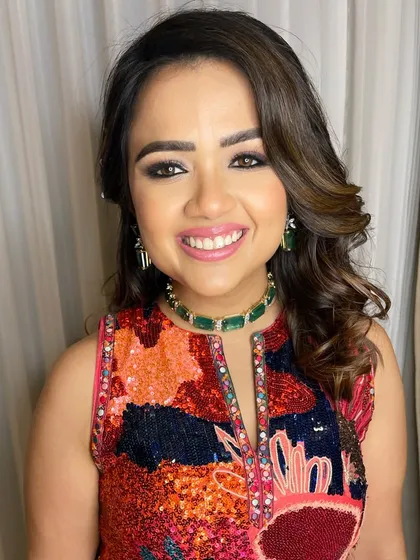 A happy client is my greatest reward. This close-up shows off her glowing skin and the perfectly blended smokey eye, a look of pure joy and confidence for her special event.