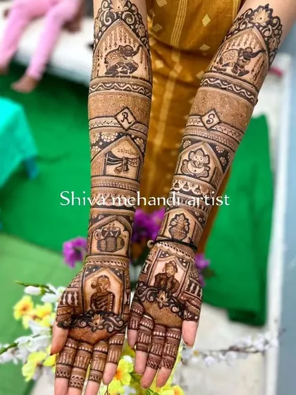 This intricate design combines portraits, wedding rituals, and auspicious symbols. It features portraits of the couple, a Ganesha figure, and the couple's initials for a truly personalized touch.