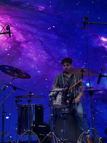 Our drummer getting in the zone during the soundcheck for the Godrej event. The galaxy-themed backdrop was absolutely epic.