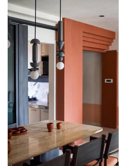 The dining area is a perfect example of how we blend different materials and styles to create a cohesive and inviting space.