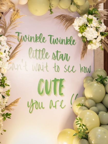A personalized sign with a sweet message for the baby. These custom details, written in beautiful calligraphy, add a heartfelt and personal touch to the baby shower decor.