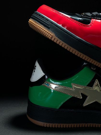 A dramatic close-up of the Bapesta UAE edition, showing the contrast between the red and green patent leather panels.