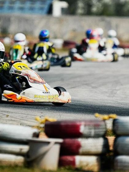 Our driver leads a pack of karts out of a corner during a national championship race.