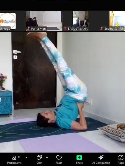 A student holding Sarvangasana (Shoulder Stand). Known as the "queen of asanas," this pose offers numerous benefits for the endocrine system, including the thyroid.