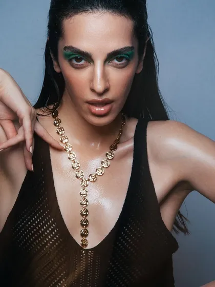 This shot combines a bold green eye with my signature dewy skin, showing that you can have both drama and a natural-looking base.