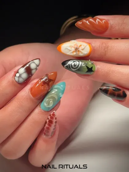 Another angle of this textured masterpiece. Here you can see the detail in the orange floral design and the black spiral art, showcasing the variety in a single set.