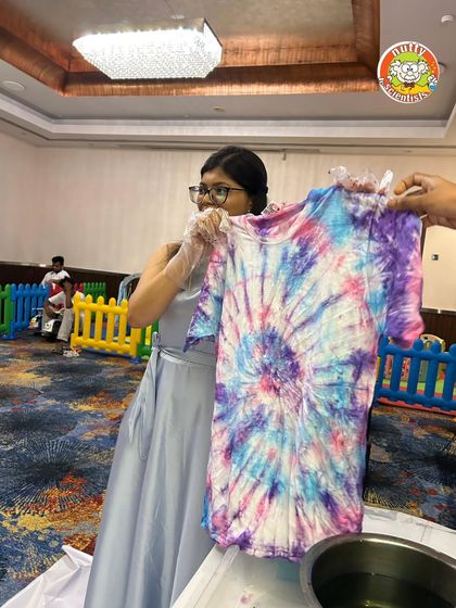 Every shirt tells a different story. This beautiful blend of colors was created during one of our corporate event workshops, proving that hands-on science fun is a hit with all ages.