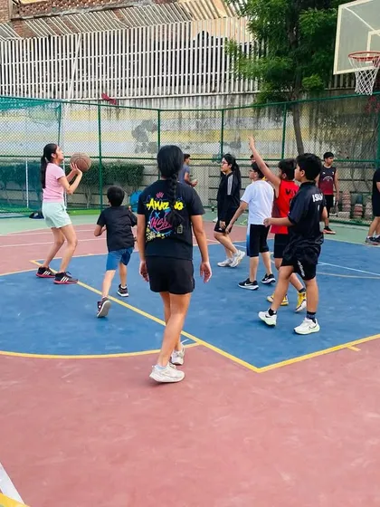 A young player looks to pass to an open teammate.