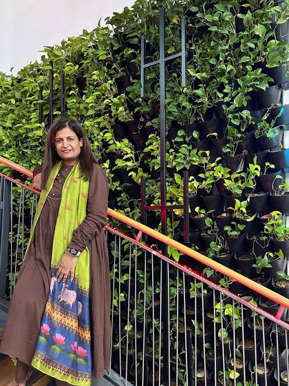 Another angle of me with the "Narcissus Project" vertical garden. These living walls are a testament to how biophilic design can make workspaces healthier, happier, and more connected to nature.
