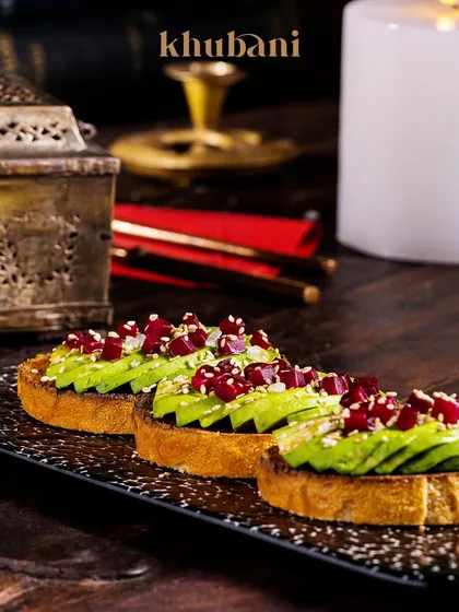 Fresh, flavorful, and fabulously plated. Our avocado toast, topped with pomegranate jewels, is a perfect example of culinary perfection for a light meal.
