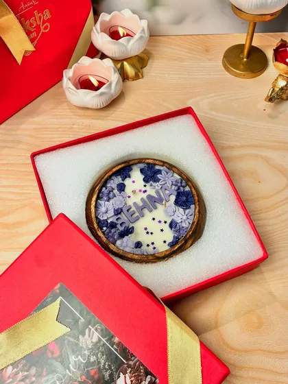 A personalized 'Behna' candle, beautifully presented in its gift box. It's a hug in a box, ready to be gifted to your sister this Raksha Bandhan.