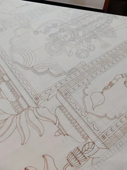 The brown outline of the decorative border and background elements of the Srinathji painting.