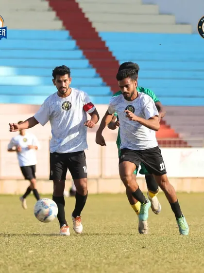 Two teammates working in tandem, pressing the opposition and moving as a cohesive unit.