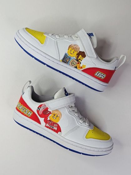 A full view of the Lego City custom Nikes. The bright red and yellow color blocking makes them super fun and playful.