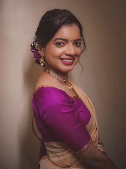 A bright and happy portrait of the bride-to-be. Her direct gaze and joyful smile capture the excitement of her engagement day perfectly.
