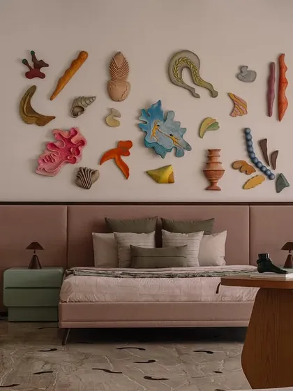 A bedroom should be a reflection of its owner's dreams. In this junior master suite, we collaborated with an artist to create 'Love is a Wave,' a hand-crafted wall installation that transforms the room into a serene, meditative, and art-filled sanctuary.