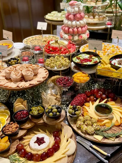 A look at one of our spectacular grazing tables, crafted for a luxury brand event. We combine artisanal cheeses, fresh fruits, savory bites like spinach and feta tarts, and sweet treats like macaron towers to create a spread that is as beautiful as it is delicious.