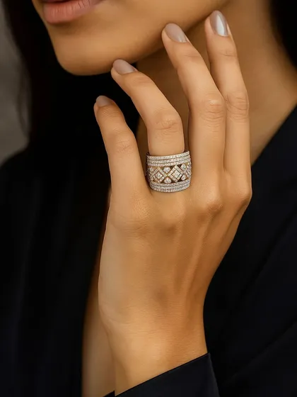 A different angle of the wide band statement diamond ring, showing how it elegantly wraps around the finger. Its layered design creates a sense of depth and luxury.