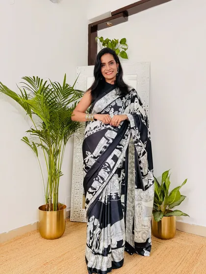 This black and white abstract print saree is a bold and artistic choice for the office. It's a statement piece that is still very professional and chic.