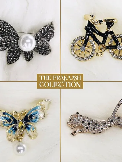 Express your personality with our collection of novelty brooches. This selection includes a pearl-accented leaf, a crystal-studded bicycle, an enameled butterfly with a pearl drop, and a sparkling leopard, each designed to be a conversation starter.