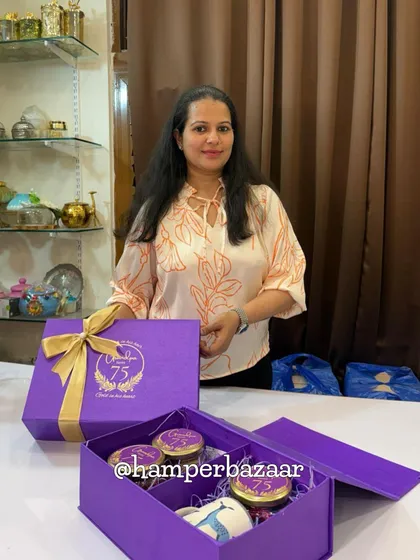 Posing proudly with the 75th birthday hamper we created! We love bringing your vision to life and creating gifts that celebrate life's biggest milestones.