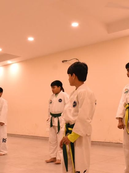 Students line up for their belt grading exam, ready to demonstrate what they have learned.