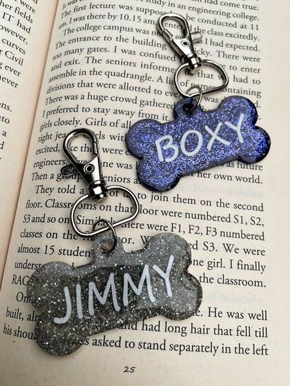 A pair of custom dog tags for 'Boxy' and 'Jimmy'. You can choose the color and glitter to perfectly match your pet's personality.