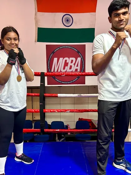Gold and Silver at the Inter-Collegiate Boxing Tournament. Vaishnavi Lokare and Malhar Bhosale stand proud in the ring with their medals.