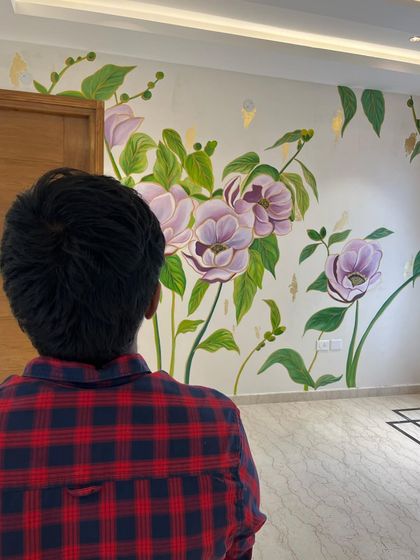 A look at the floral and gold foil mural from a different angle. The subtle shimmer of the gold leaves adds a magical touch to the realistically painted flowers.