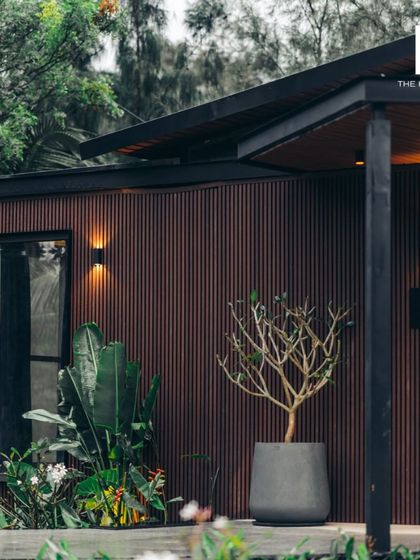 The exterior of the 2BHK cargo home, showing the beautiful wood cladding and modern design.