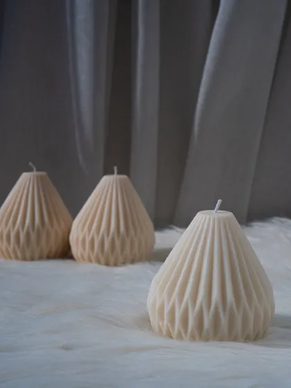 Our pear-shaped sculptural candles, with their intricate geometric pattern. They look beautiful on their own or grouped together.