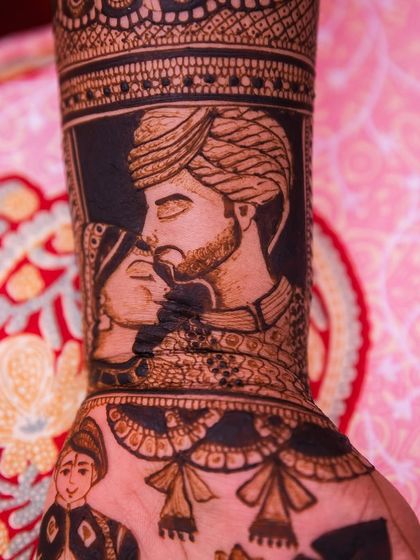 A close-up of a romantic couple portrait, capturing a tender moment between the bride and groom. This style of portraiture adds a deeply personal and emotional touch to any bridal mehendi.