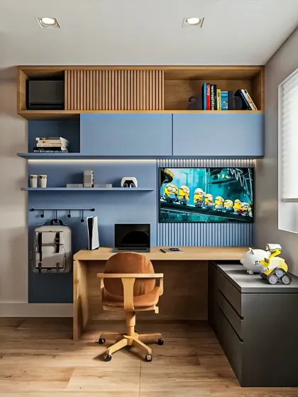 A compact and highly functional study and gaming station designed for a teen's room. The setup includes an L-shaped desk, overhead cabinets, open shelving, and dedicated space for a laptop, console, and accessories, all within a small footprint.