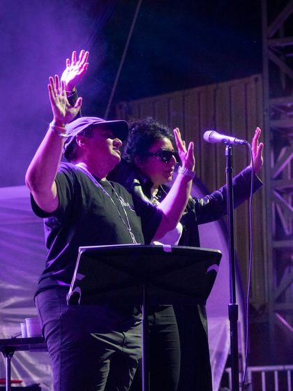 Raising our hands with the crowd. It's a two-way street; the audience gives us energy, and we give it right back.