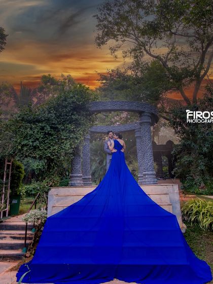 A dramatic shot of a flowing blue gown against our stone gazebo, creating a stunning contrast with the natural surroundings.