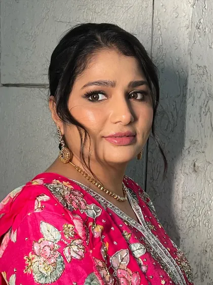 A beautiful portrait showcasing the smokey eye and dewy skin. This look is perfect for anyone who wants to feel glamorous and confident at their event.