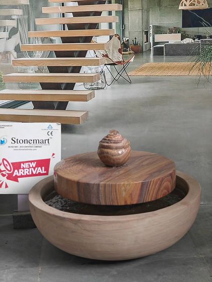 The compact size of this millstone fountain makes it suitable for a balcony or a small terrace garden.