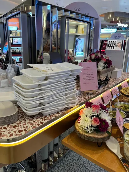 Our professional setup includes everything needed for a seamless event, right down to the plates and cutlery. Here you can see our clean and organized station at the Tira Beauty pop-up, ready for service.