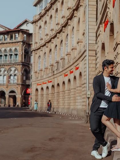 A stylish pose against the colonial-era architecture of Mumbai. I love using the city's textures and lines to create visually interesting and modern couple portraits.