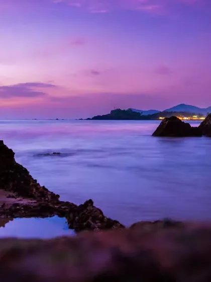 Capturing the magic of a Goa sunset. This long exposure shot turns the waves into a soft, misty sea under a stunning purple sky. This shows my ability to create dramatic, artistic landscape photos, perfect for a destination wedding album.
