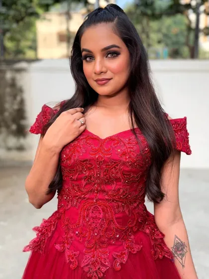 A confident pose from the client. The makeup, hair, and outfit all come together to create a powerful and beautiful image.