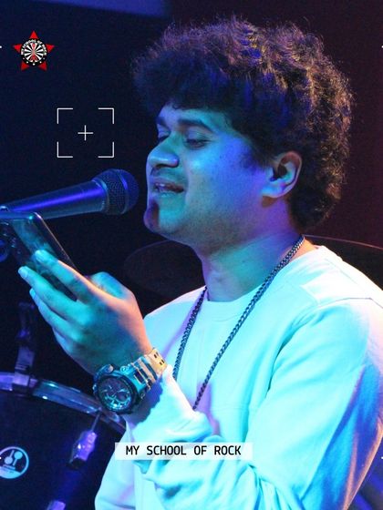A close-up of a singer pouring his heart into a song. Every performer gets professional photos to capture their moment in the spotlight.