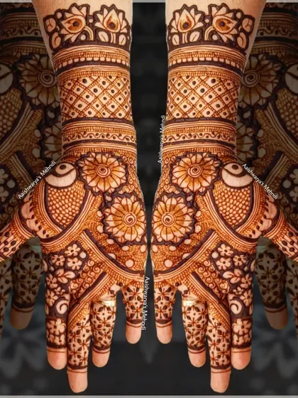 A stunning design with bird motifs on the palms, surrounded by intricate floral and geometric patterns.