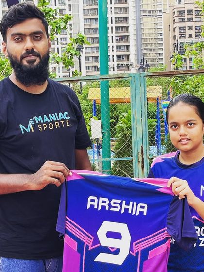 Our coach officially welcomes Arshia to the team, presenting her with her personalized jersey. We're excited to see her grow as a player.