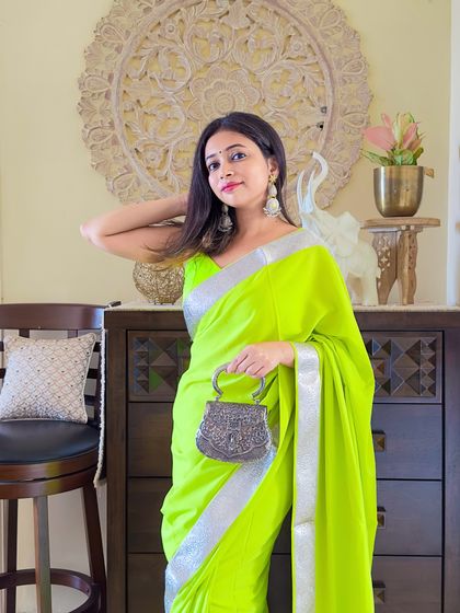 Playing with poses in my neon saree. This color looks amazing on our wheatish skin tones and instantly makes you the center of attention.