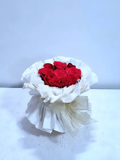 A stunning bouquet cake, where the entire bouquet is made of chocolate mousse cake and raspberry filling. The "wrapping" is created with textured rice paper.