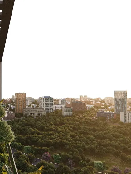 A view from one of the landscaped terraces of the Narmada building, looking out over the city. The design prioritizes a connection to the outdoors, providing tranquil breakout spaces for office users.