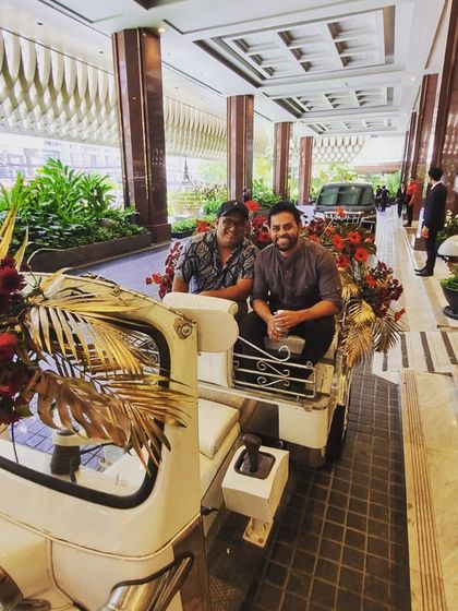Having some fun in a decorated auto-rickshaw at a wedding venue. It's a reminder that while I'm serious about the music, I'm also there to be part of the fun and joy of the celebration.